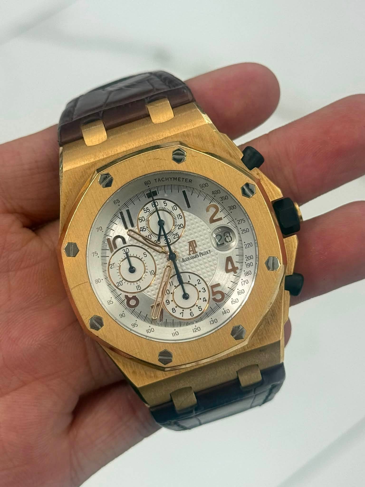 May be an image of wrist watch and text