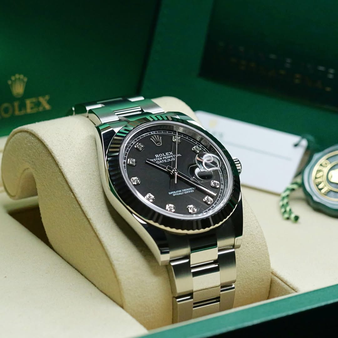 May be an image of wrist watch and text