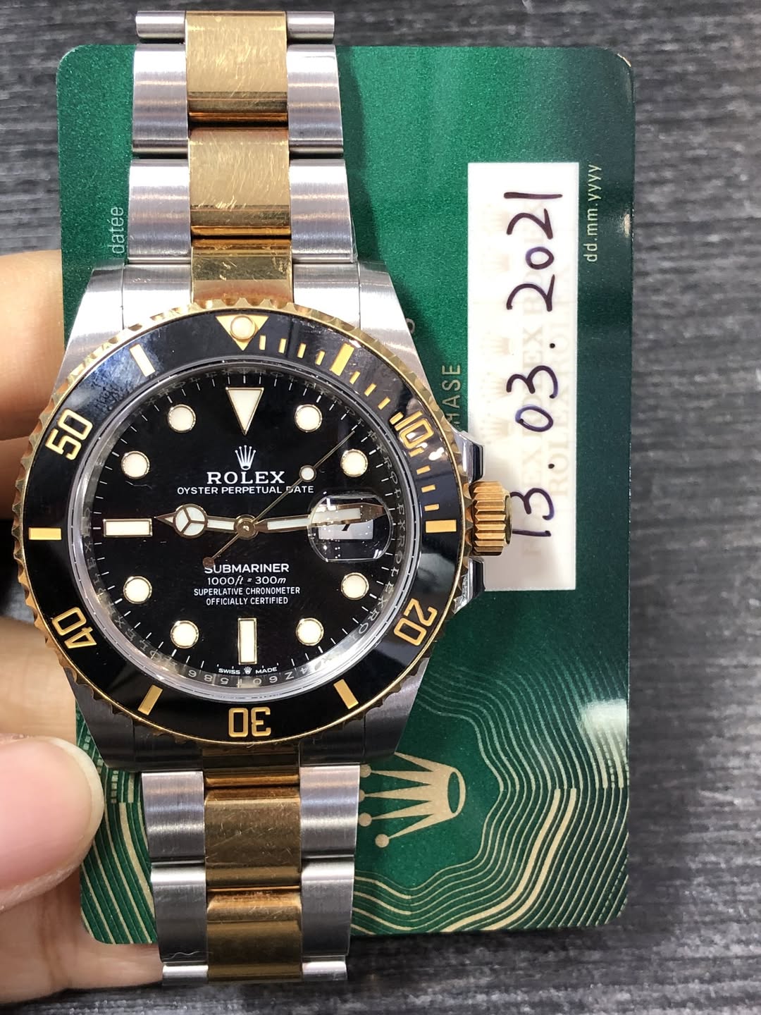 May be an image of wrist watch and text
