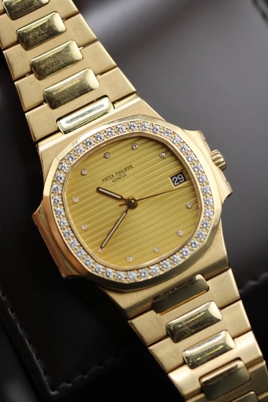 May be an image of wrist watch and text