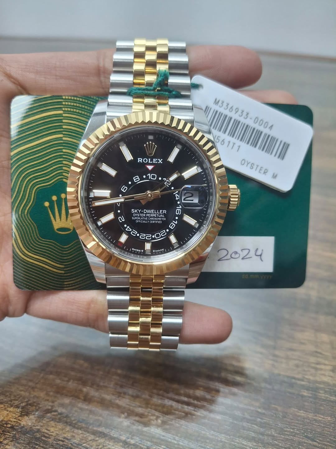 May be an image of wrist watch and text