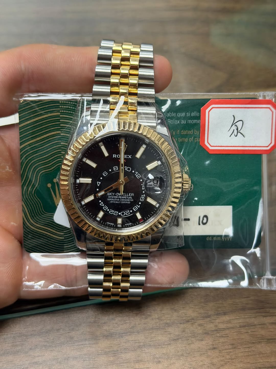 May be an image of wrist watch and text