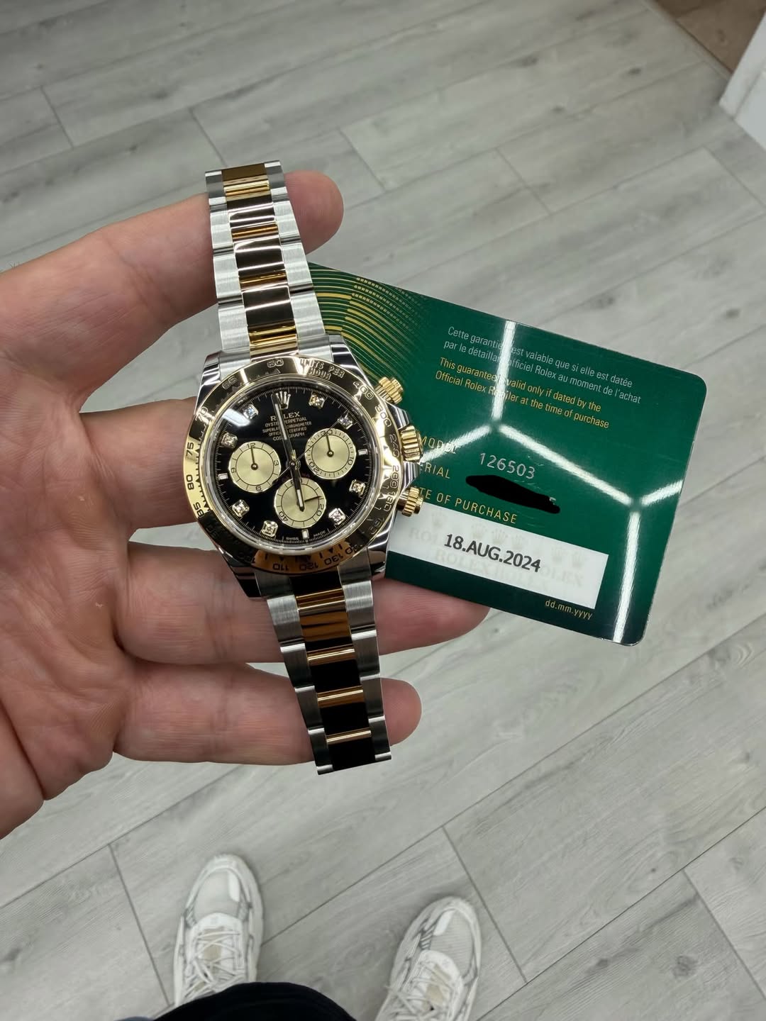 May be an image of wrist watch and text