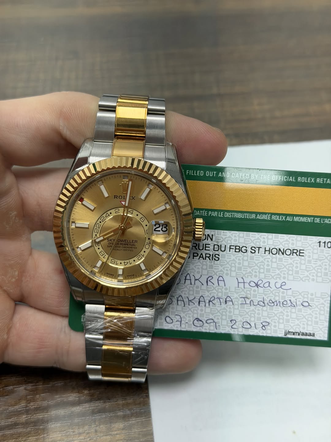 May be an image of wrist watch and text