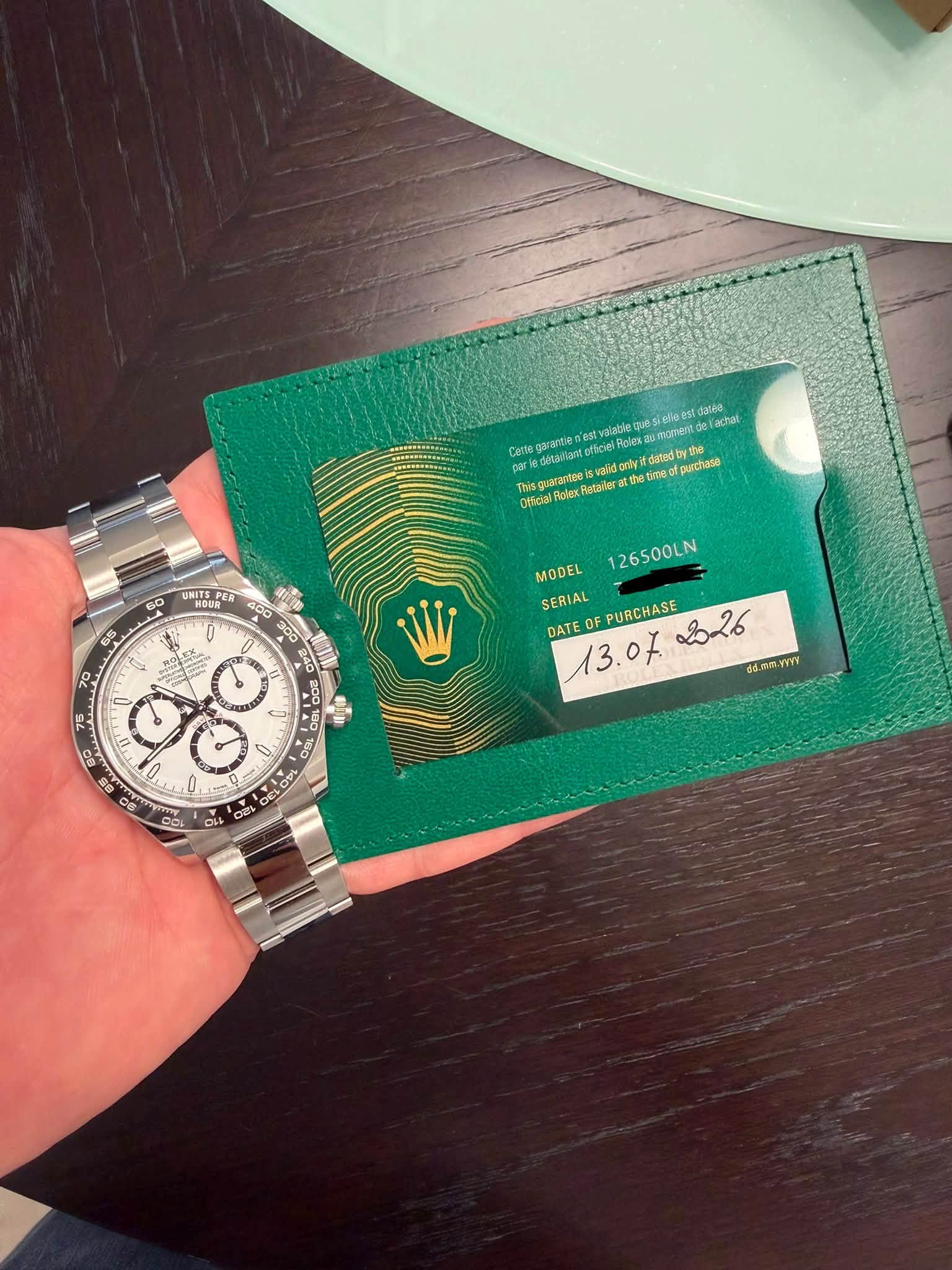 May be an image of wrist watch and text