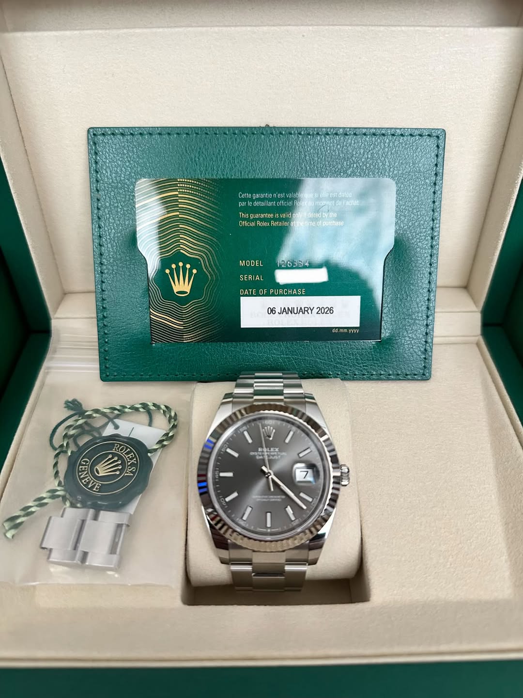May be an image of wrist watch and text