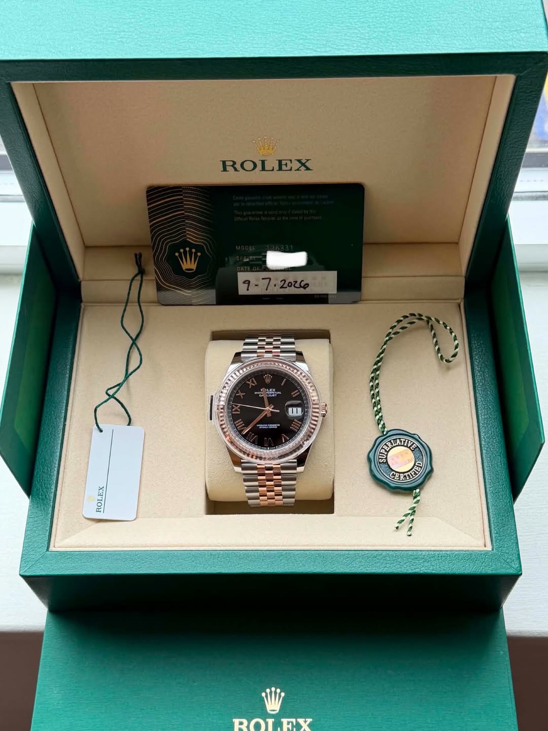 May be an image of wrist watch and text