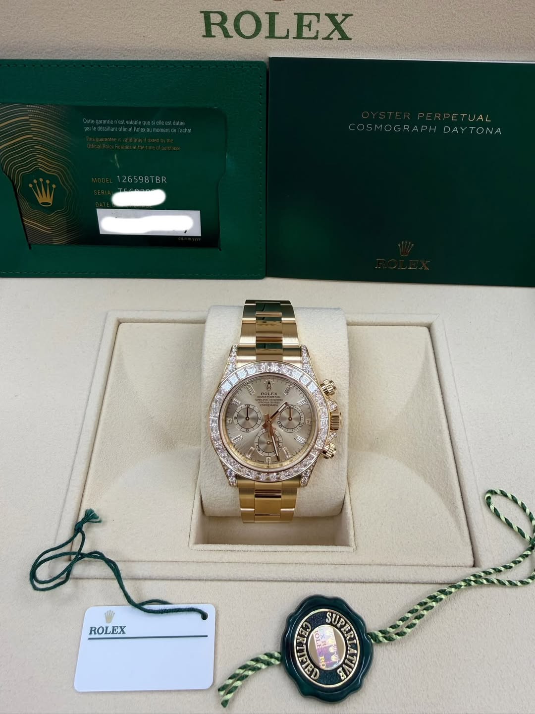May be an image of wrist watch and text that says 'ROLEX 126598TBR 6598TB TUAL COSMOG! COSMOGRAPHDAYTONA RAPH DA TONA MOG ROLEX 1OLE LE SUPER SUP CA'