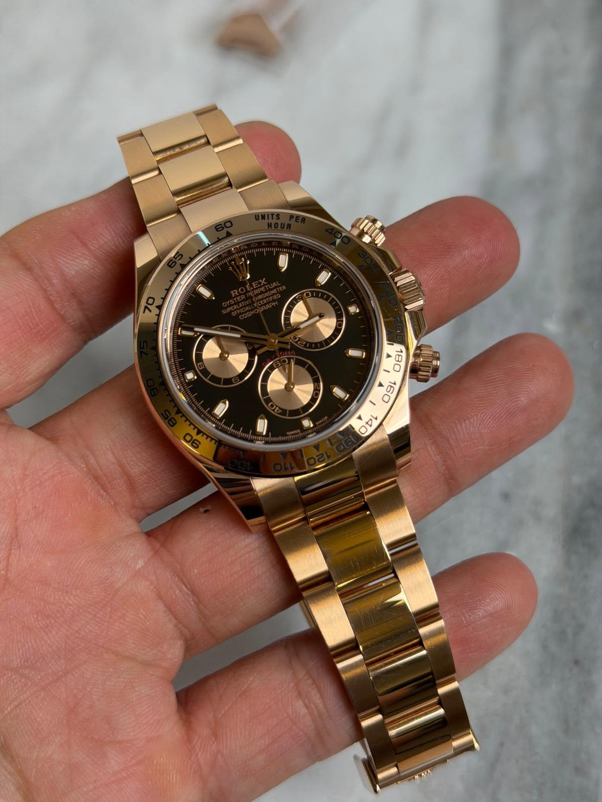 May be an image of wrist watch and text