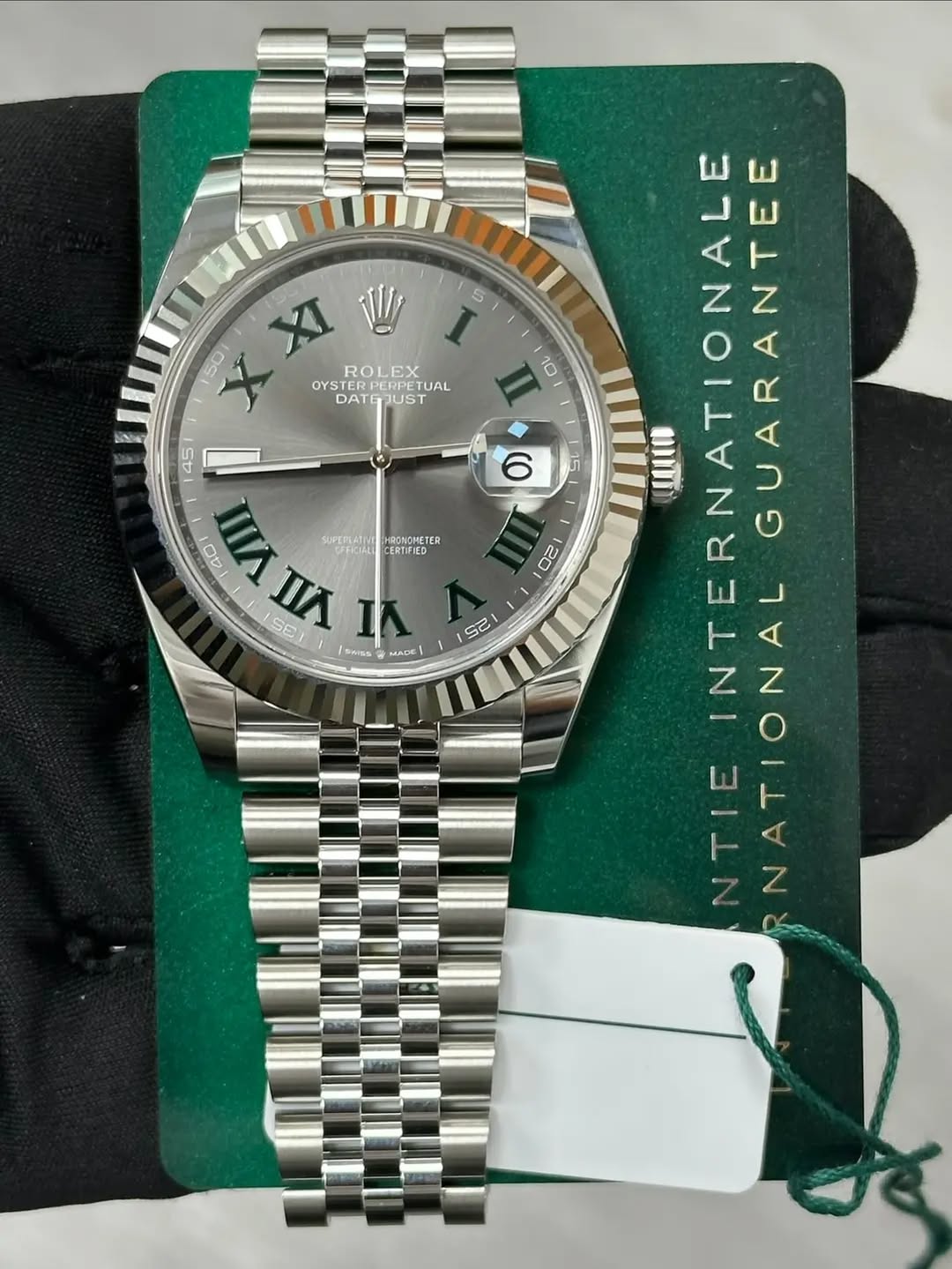 May be an image of wrist watch and text that says 'XI 1 5 I 50 ROLEX OYSTEREPETUAL EX OYSTER PERPETUAL TUAL DAT DATGJUST JUST 45 ロ0 SUPERLATINT HRONOMETER CERTIFIED SE 白 VII WAnA…