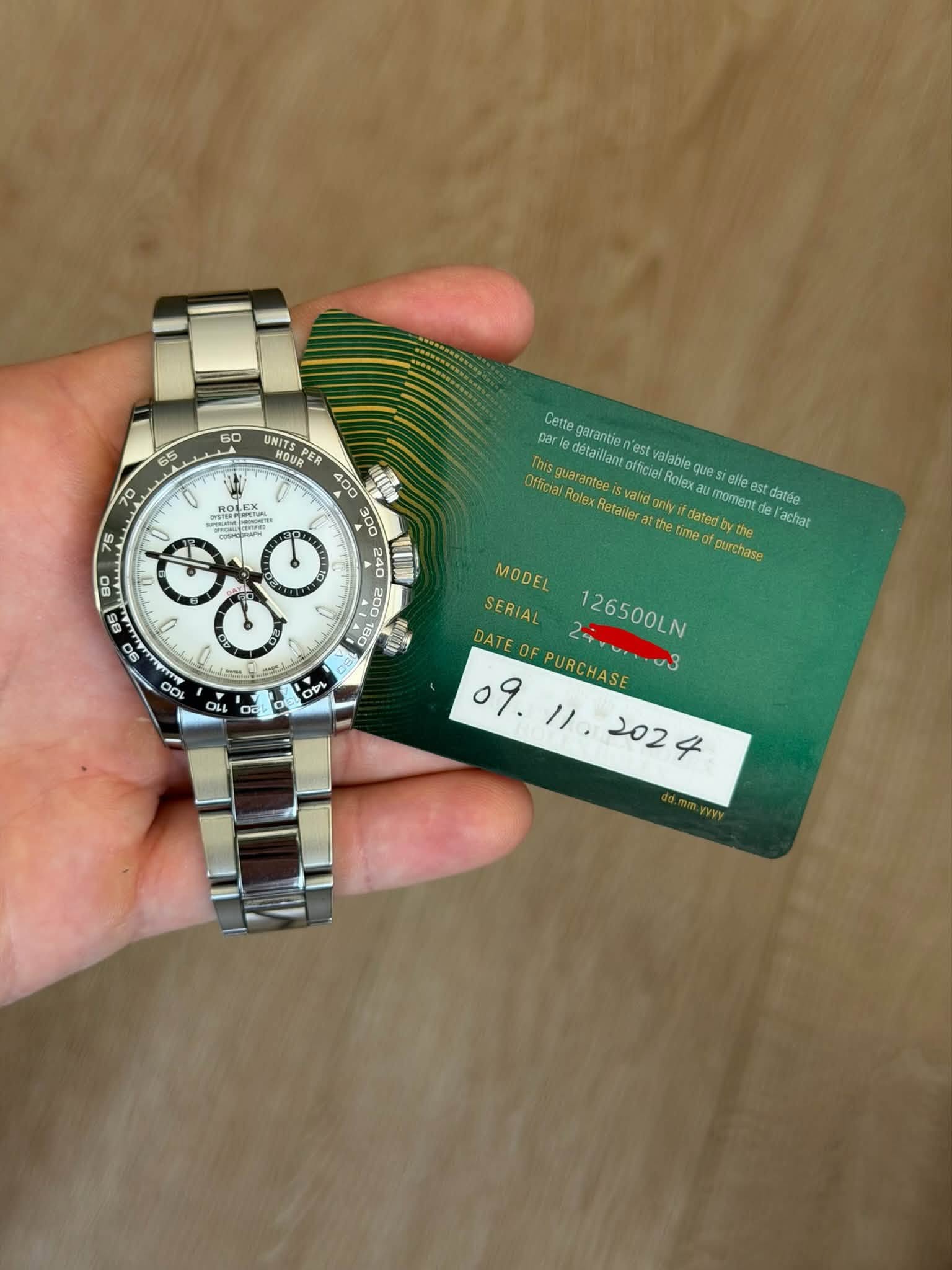 May be an image of wrist watch and text that says '60 65 UNITS NIT NOUS 70 PT Aet อร Cette garantien est par This detaillant détailant Official Rolex Retaler the guarantee Svalg…