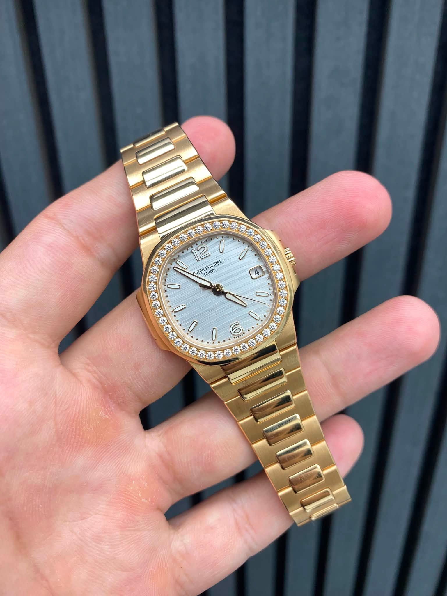 May be an image of wrist watch and text