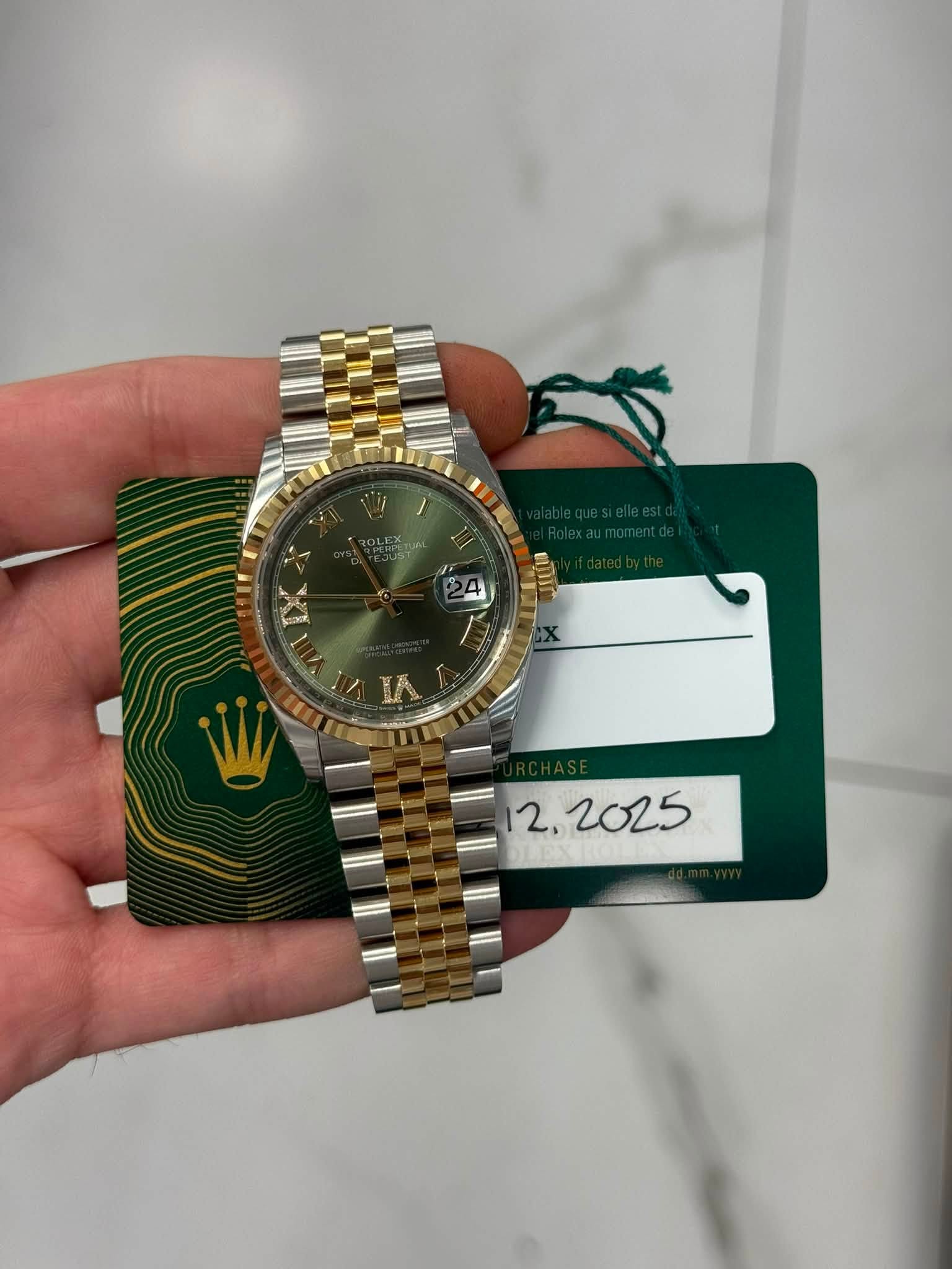 May be an image of wrist watch and text