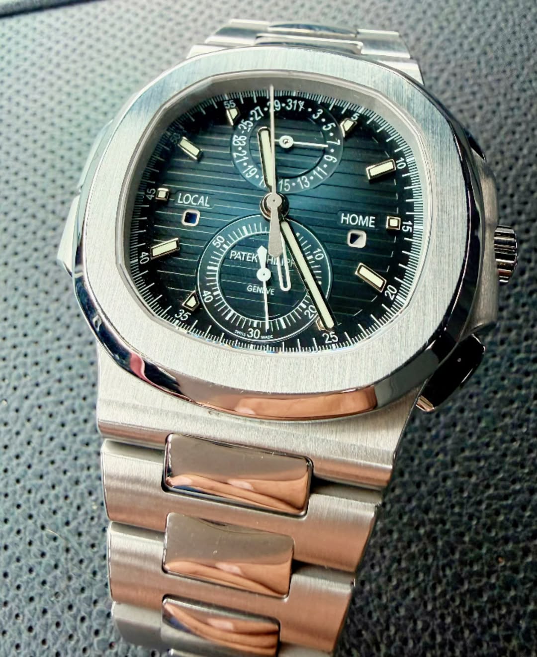 May be an image of wrist watch and text