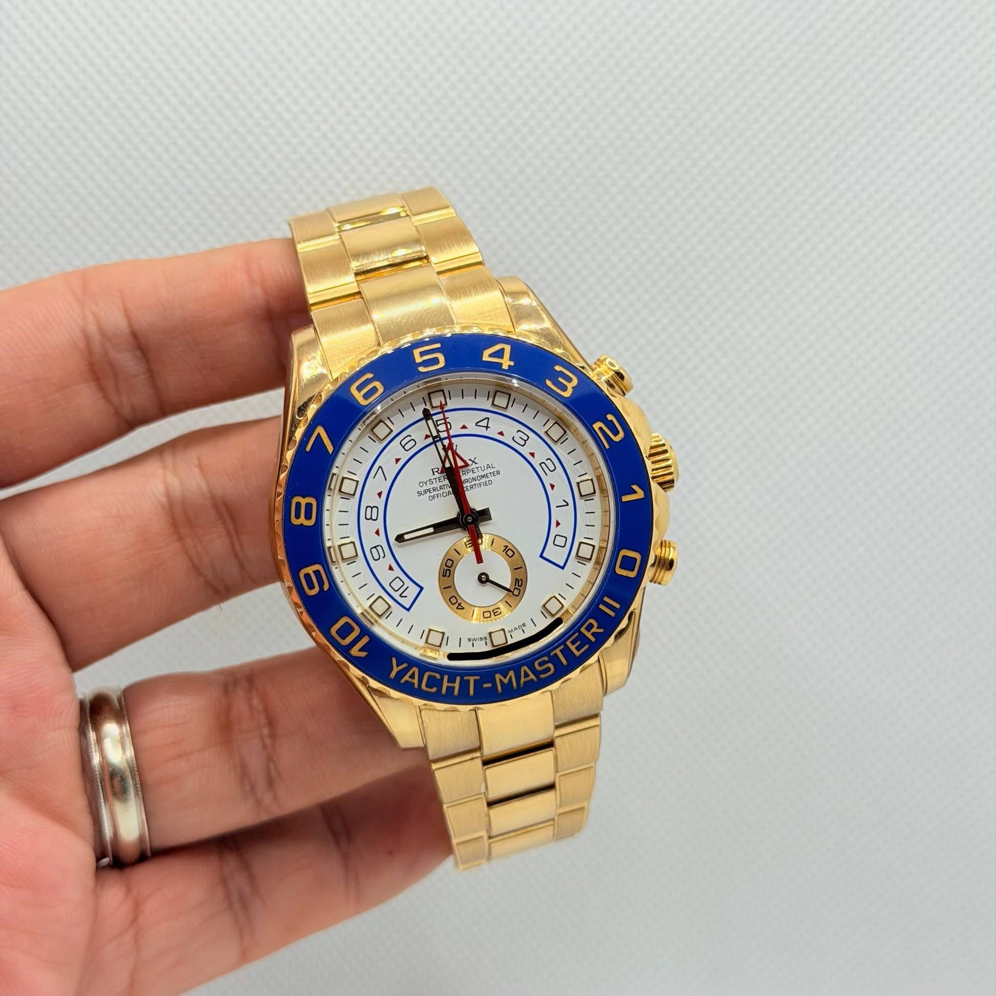 May be an image of wrist watch and text
