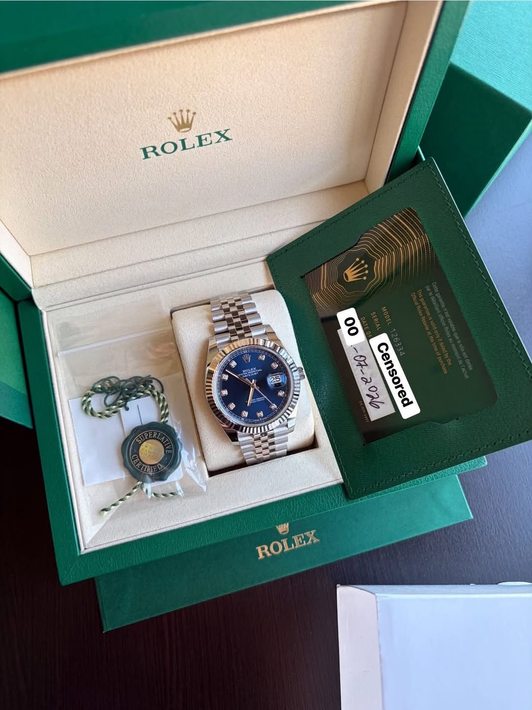 May be an image of wrist watch and text that says 'W ROLEX - ឆ S 후 2 星 贈 1 م ॐ Ou ន V T 25 富 မြ့် 5 ف 的 。 ា Censored M ROLEX'