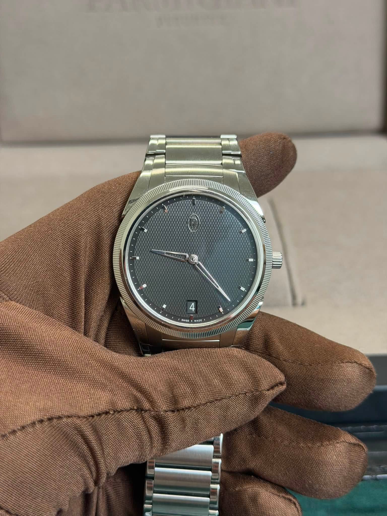 May be an image of wrist watch and text