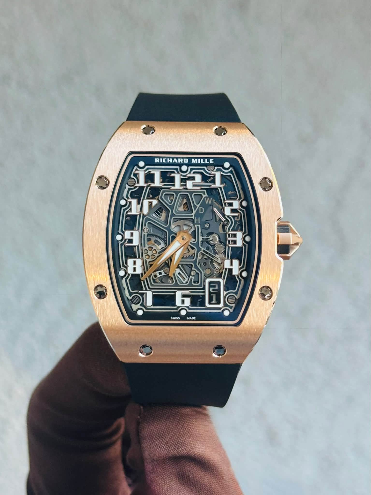 May be an image of wrist watch and text