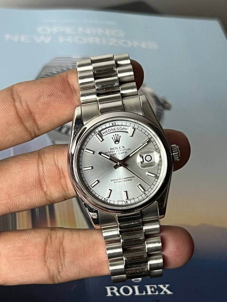 May be an image of wrist watch and text