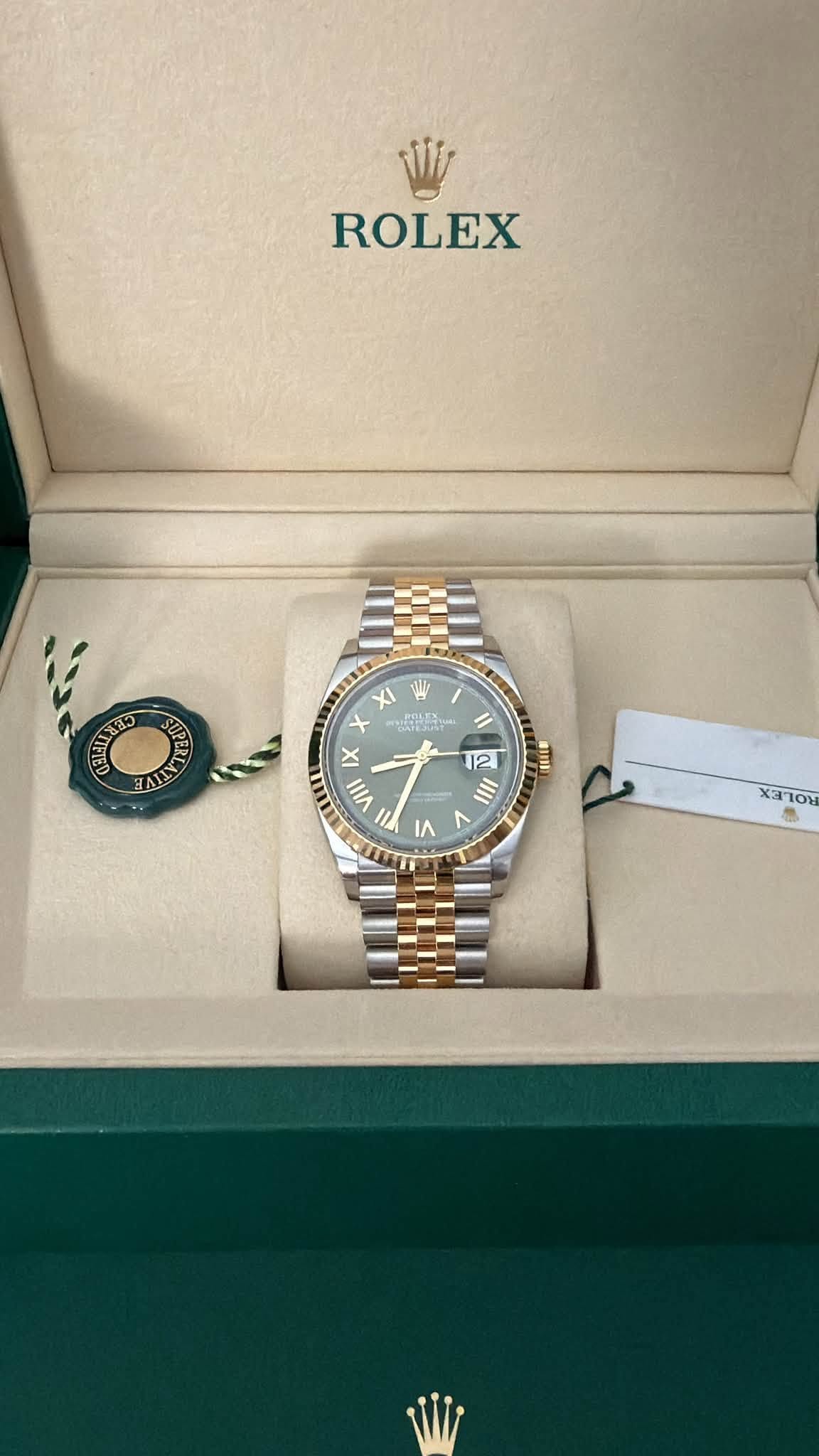 May be an image of wrist watch and text