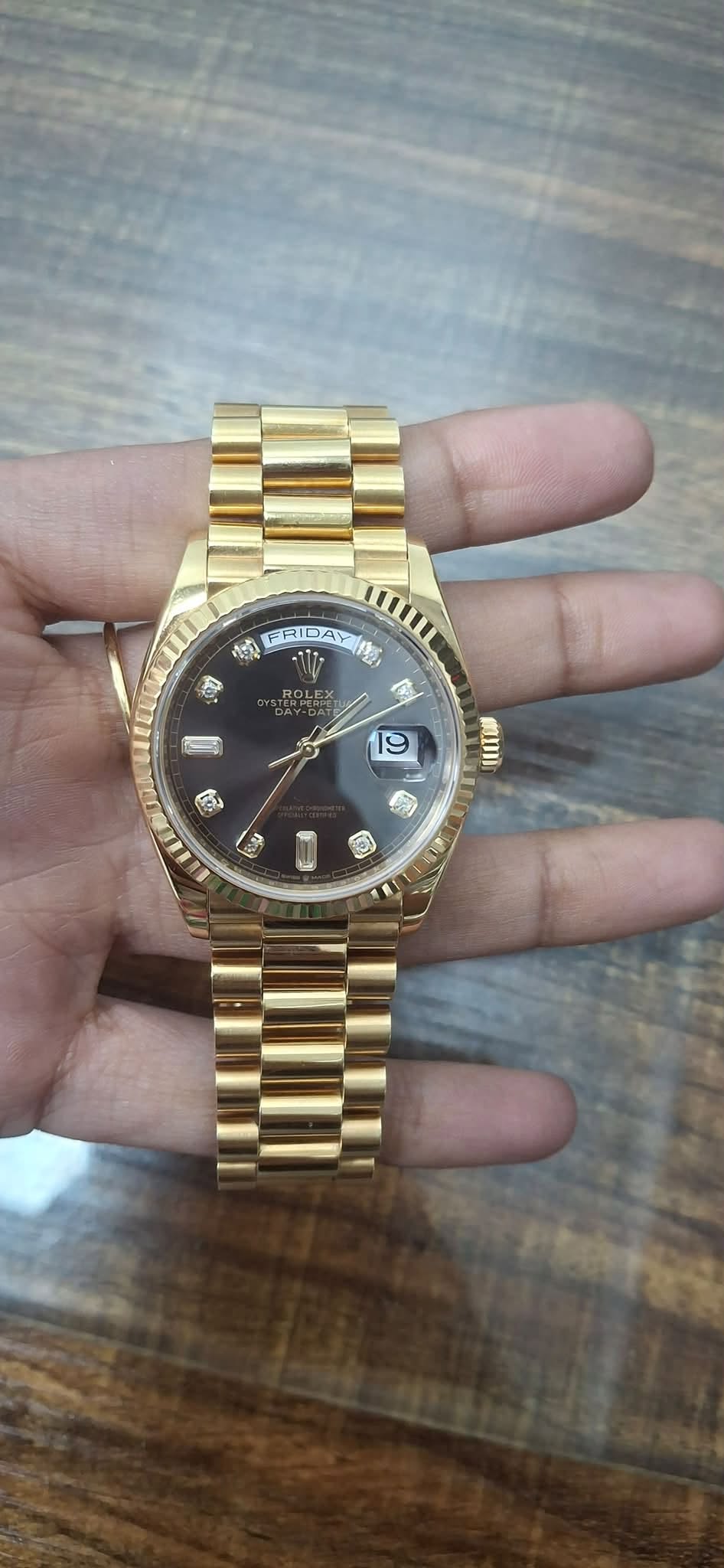 May be an image of wrist watch and text