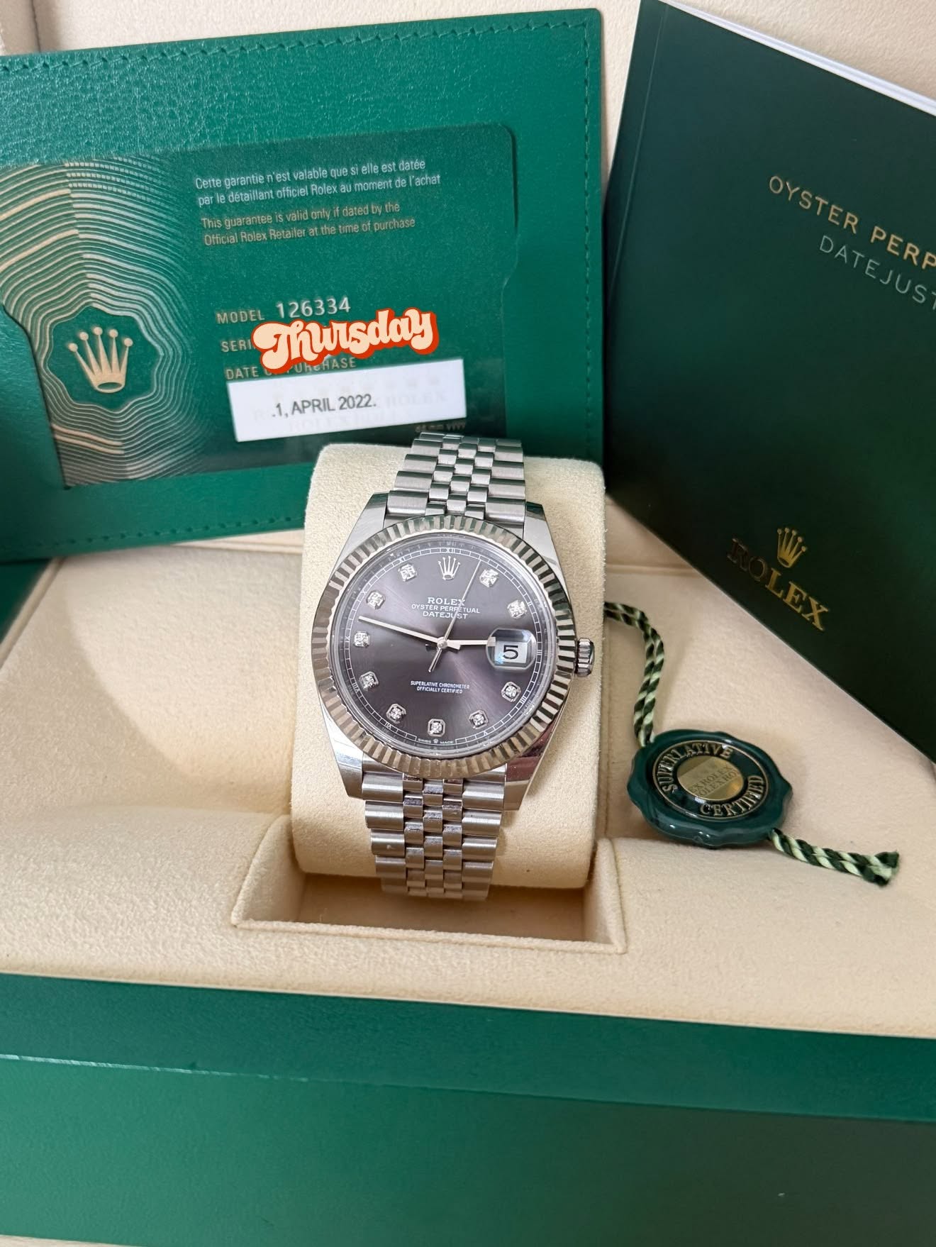 May be an image of wrist watch and text