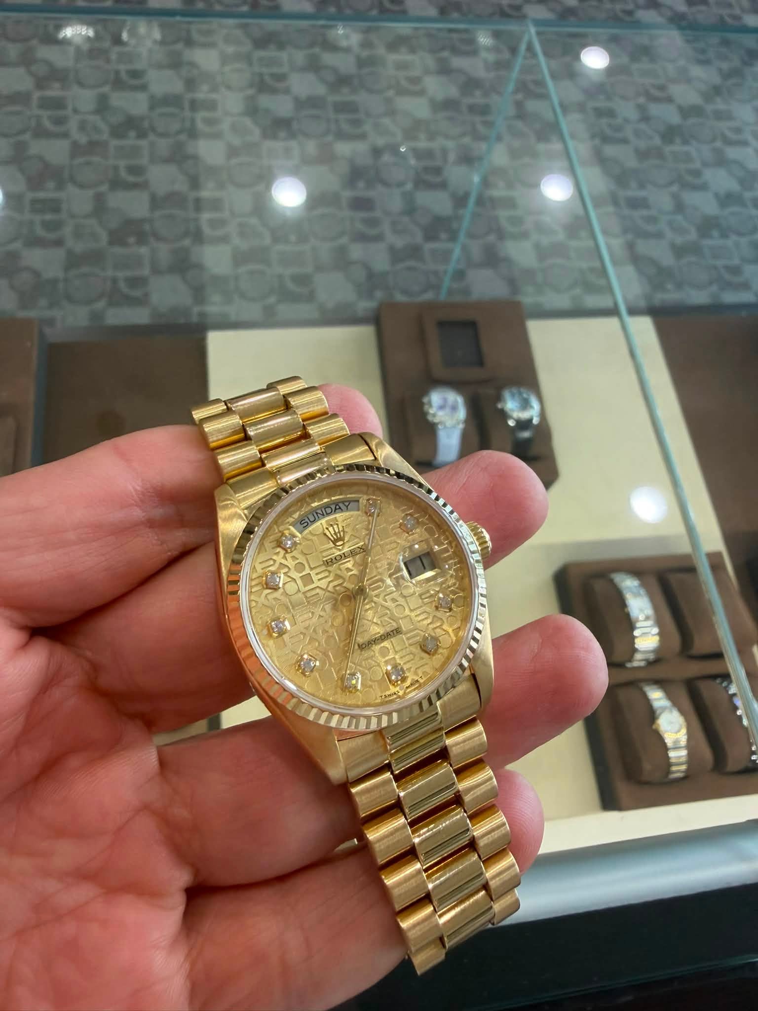 May be an image of wrist watch and text