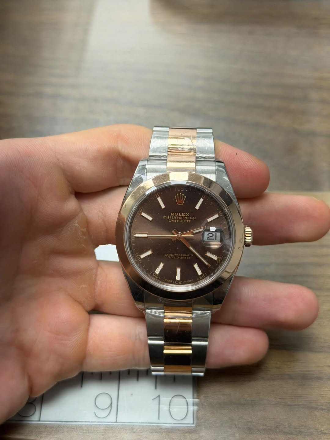 May be an image of wrist watch and text