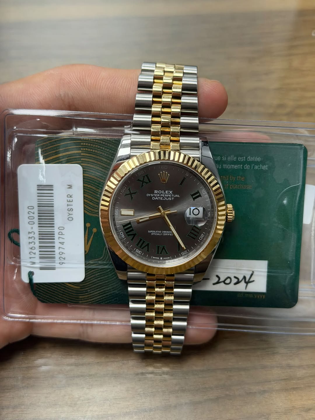 May be an image of wrist watch and text