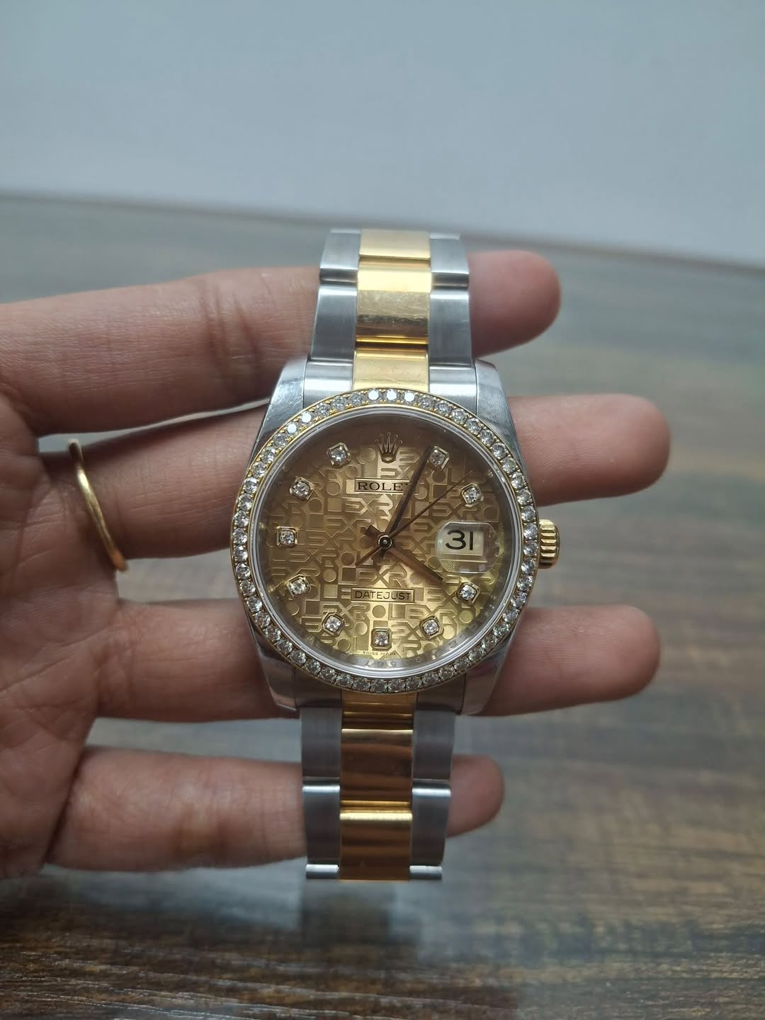 May be an image of wrist watch and text