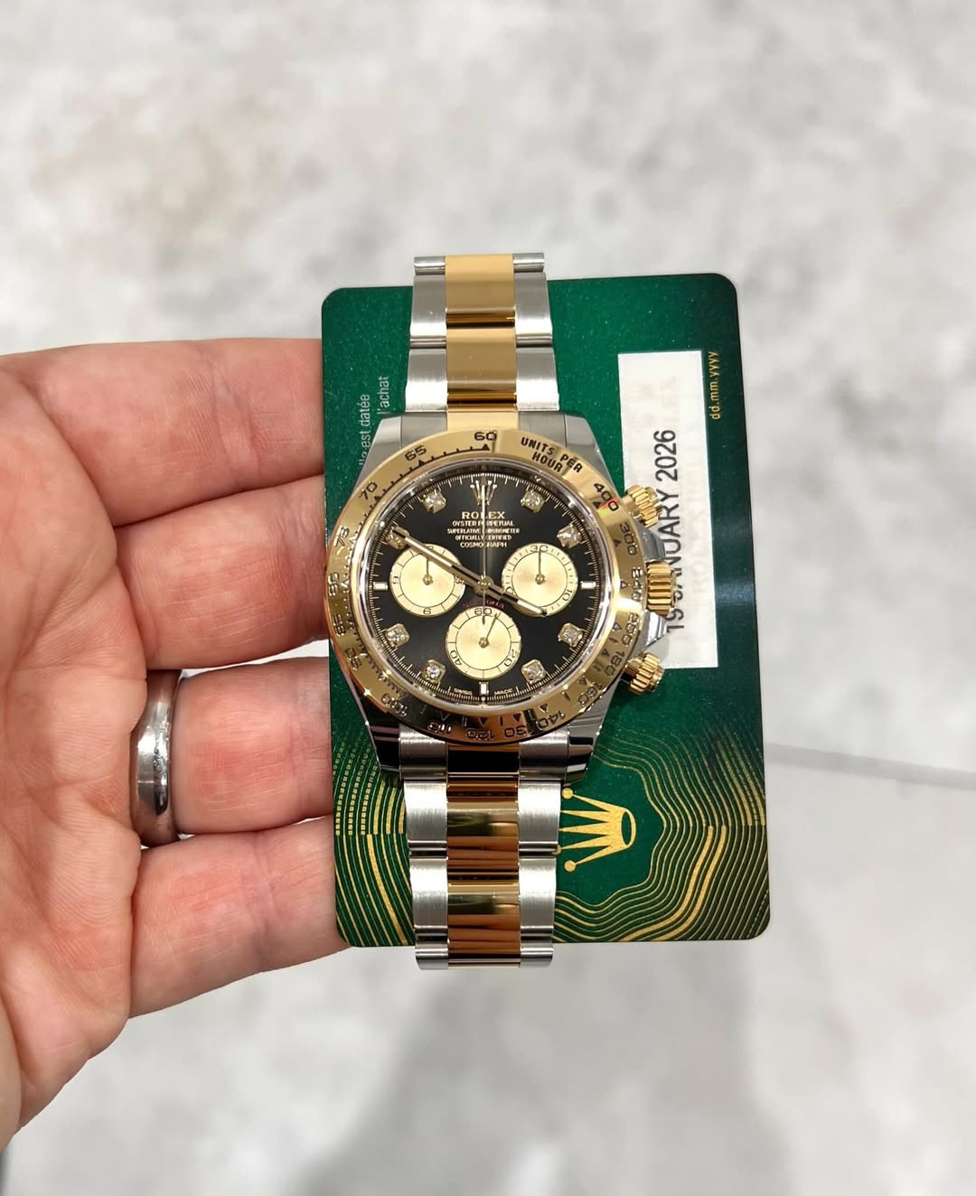 May be an image of wrist watch and text