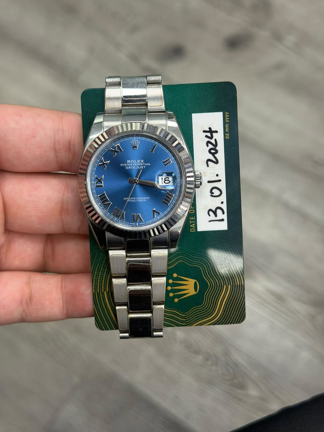 May be an image of wrist watch and text