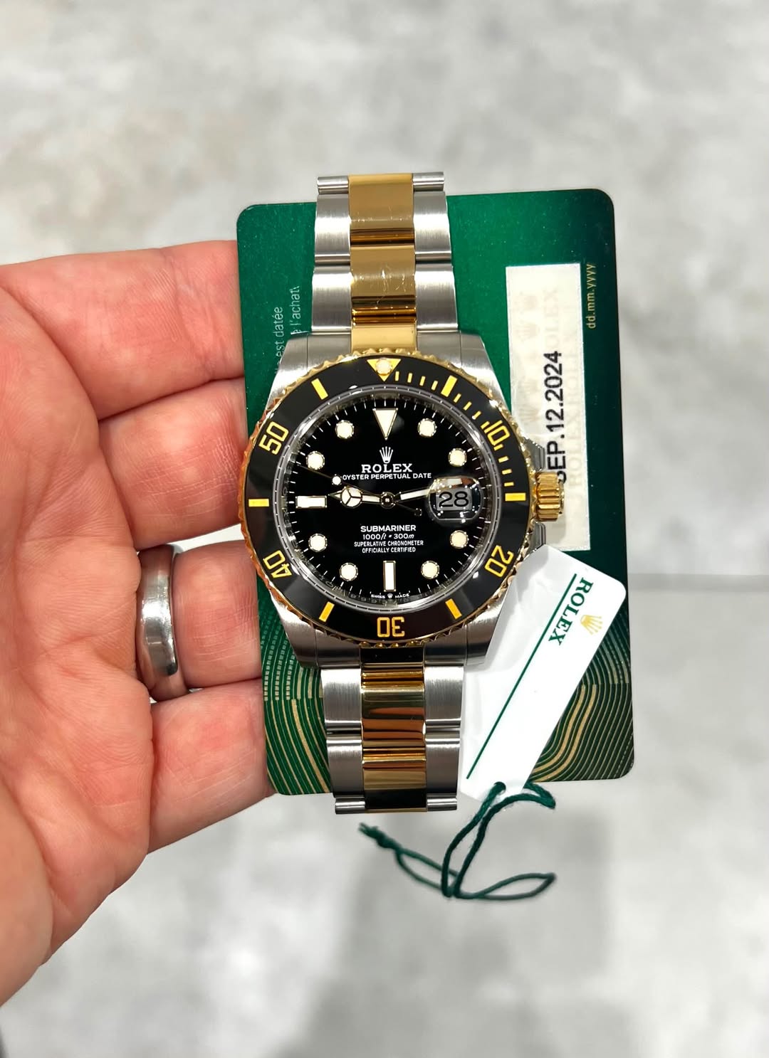 May be an image of wrist watch and text