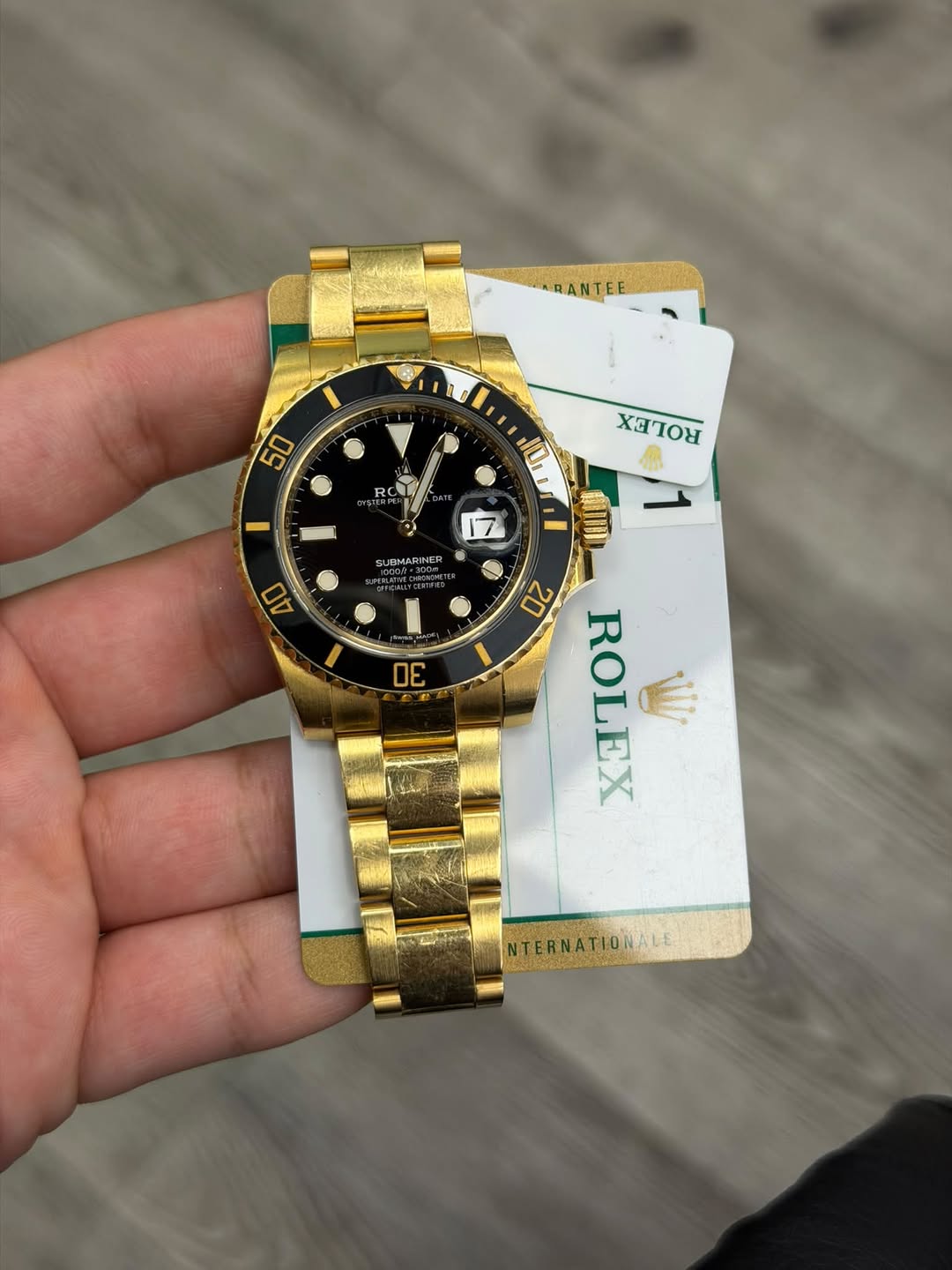 May be an image of wrist watch and text that says 'ARANTEE 50 RC XC XOTOR IDMARINER 40 10I 17 MIIL D 20 ROLEX ש 30 NTERNATIONALE NTERNA'