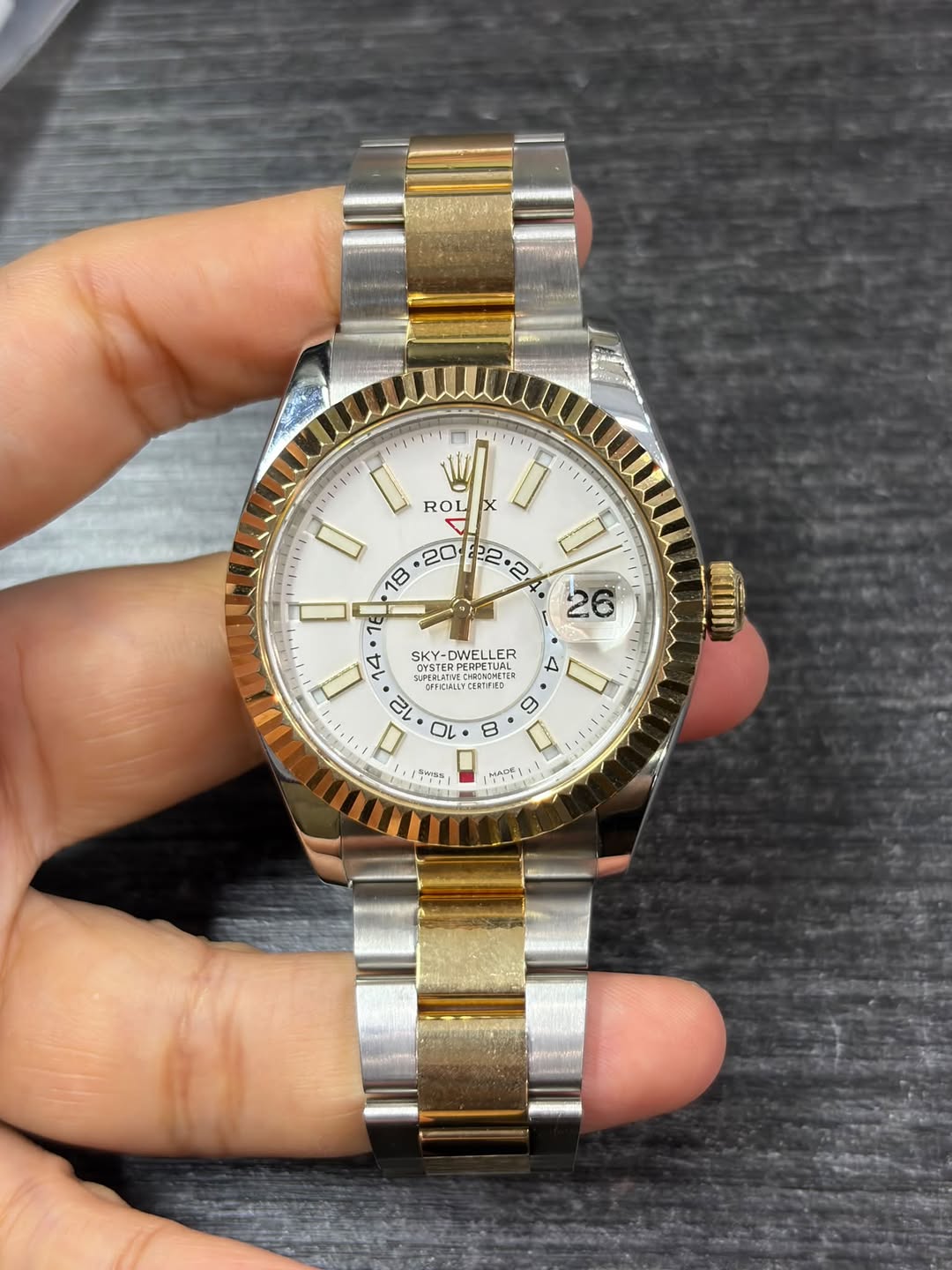 May be an image of wrist watch and text