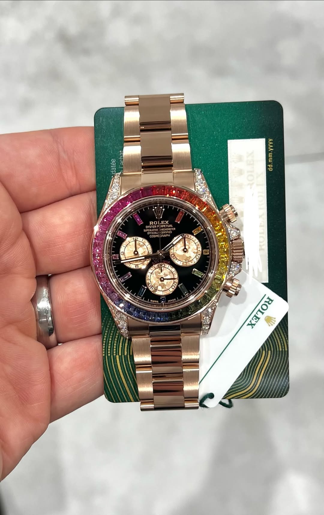 May be an image of wrist watch and text