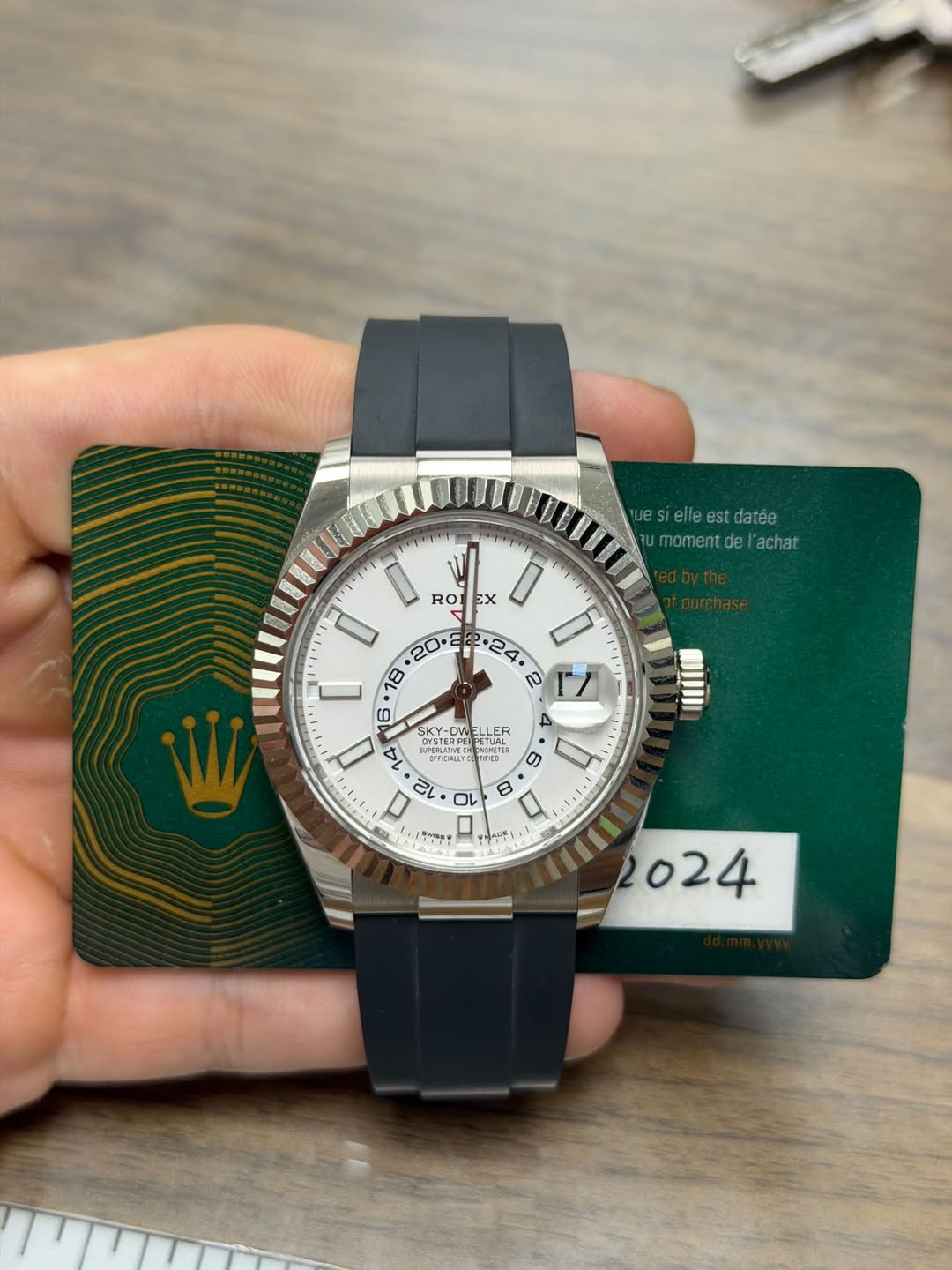 May be an image of wrist watch and text