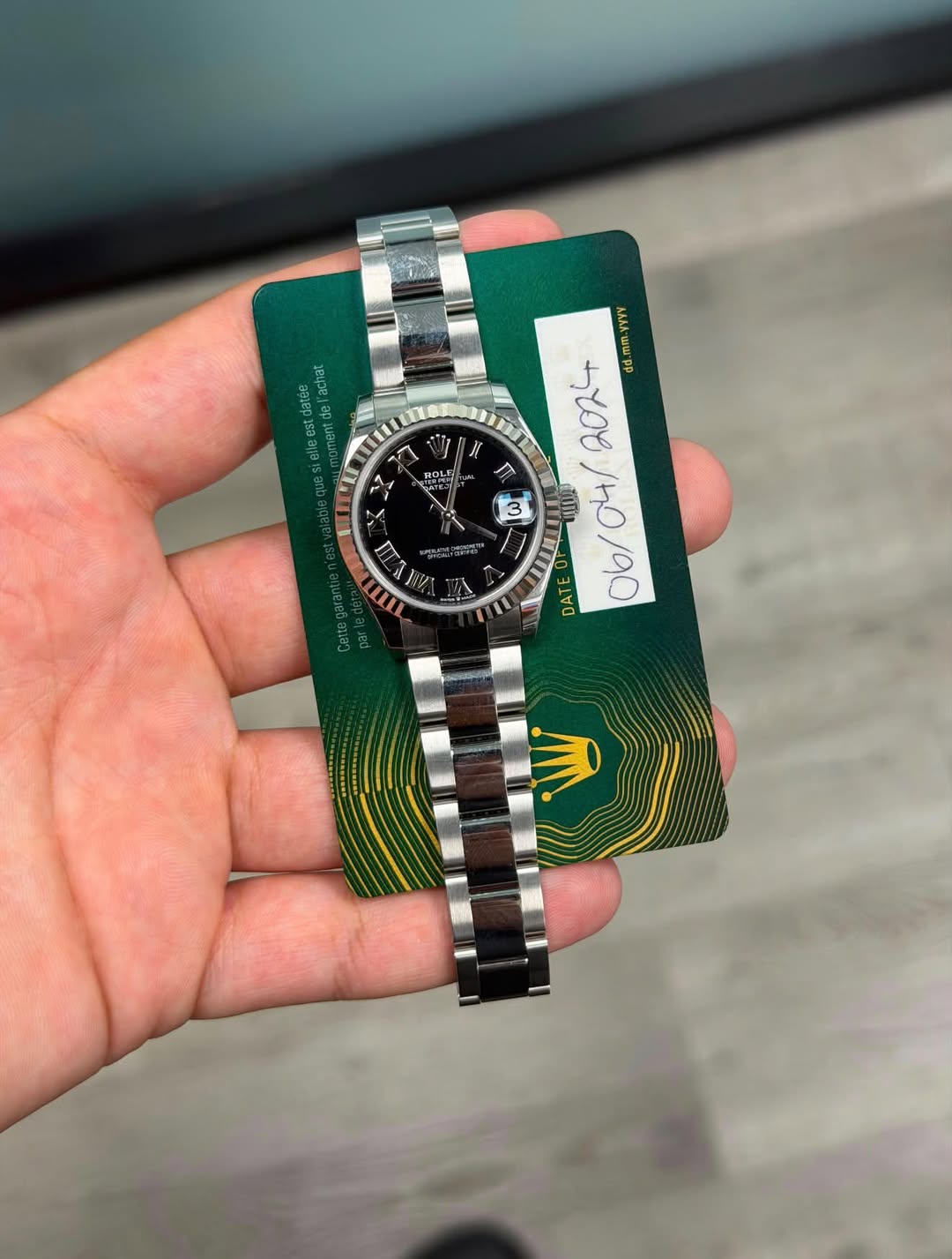 May be an image of wrist watch and text