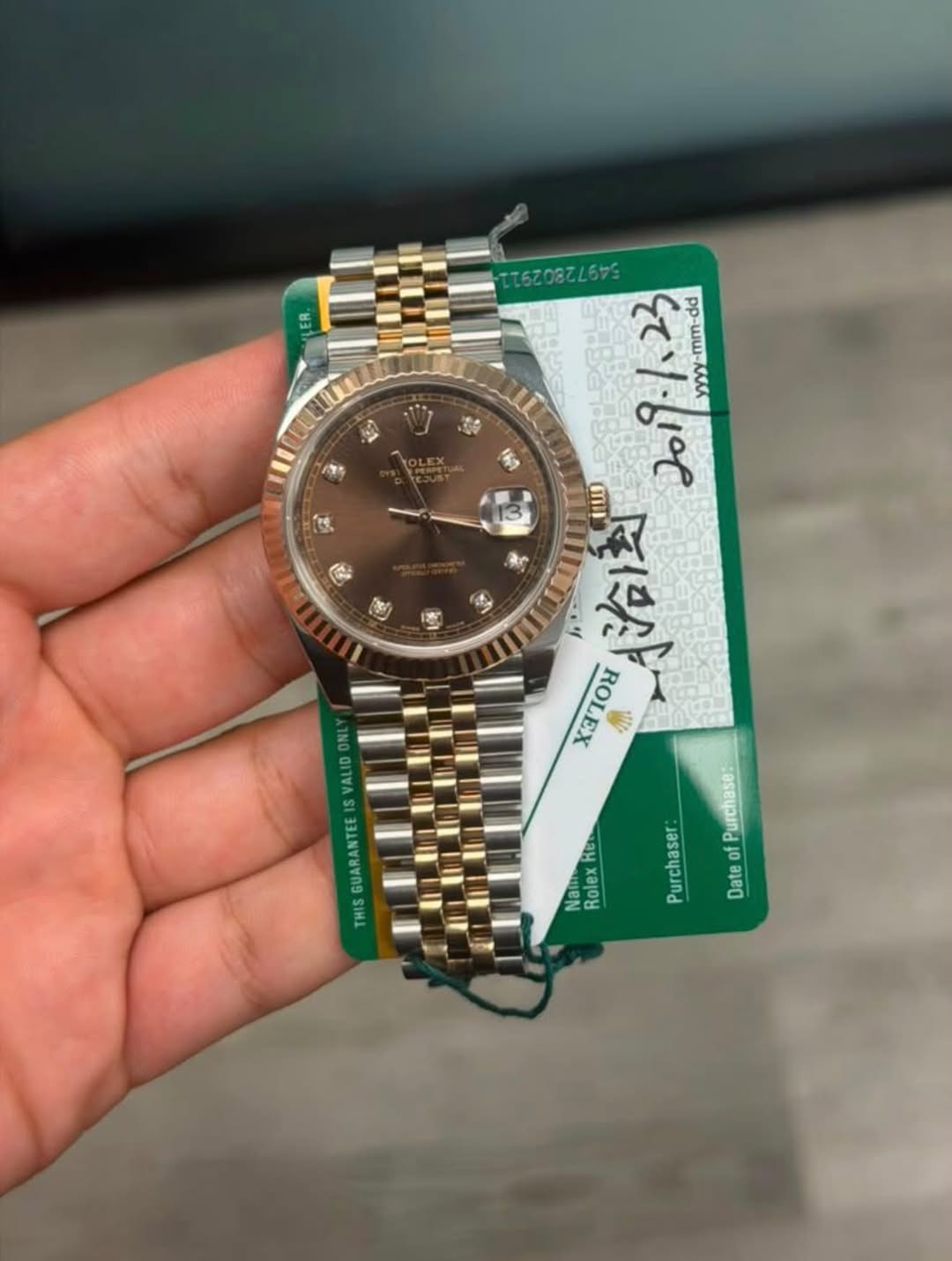 May be an image of wrist watch and text that says 'ቤት÷ MAN ጌ፡ dd -mm-dd 浴透 OLOK סד. 자 NO M INI Keb Nai adie Rolex Purchase: Purchaser f Date'