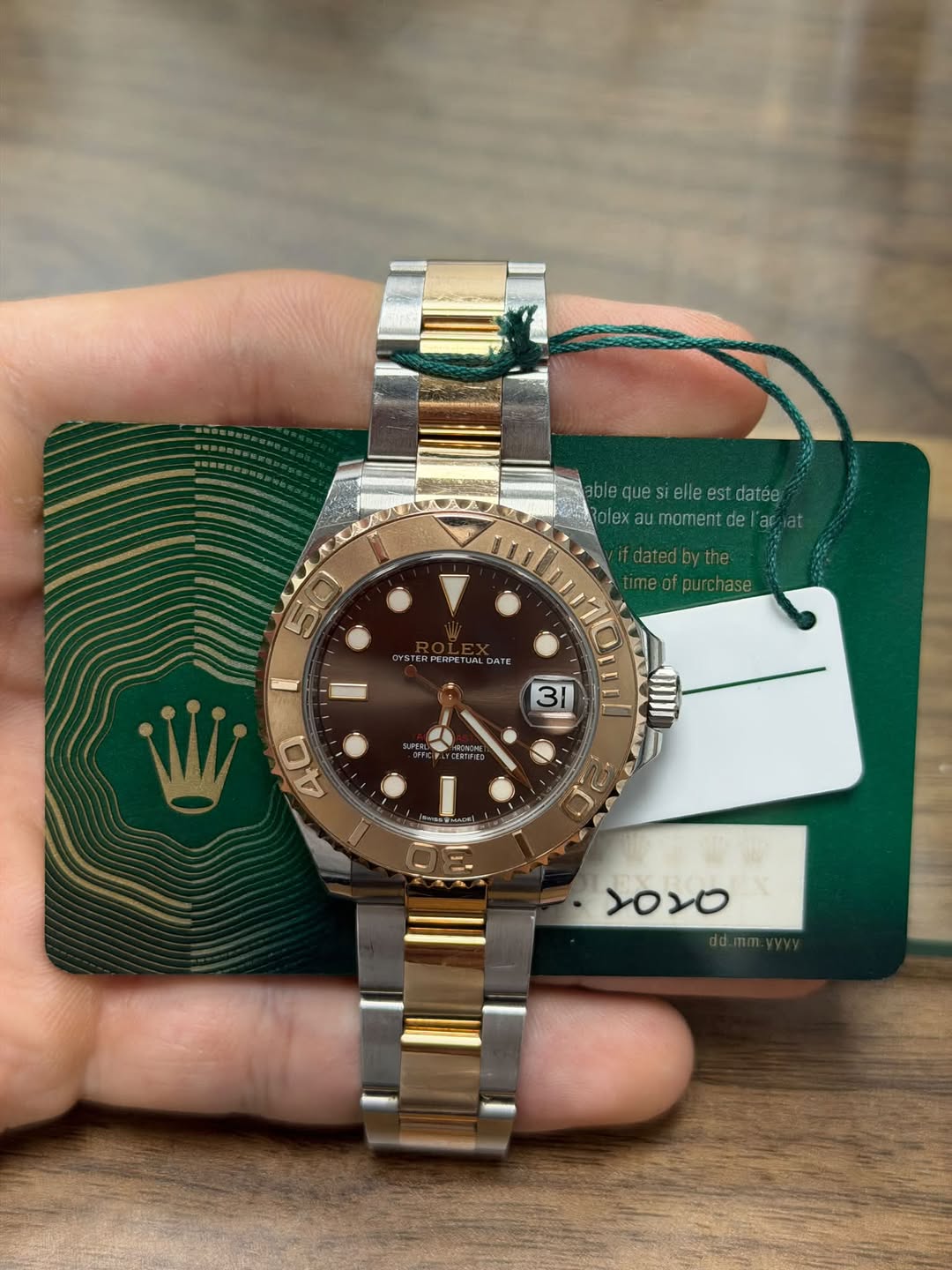 May be an image of wrist watch and text