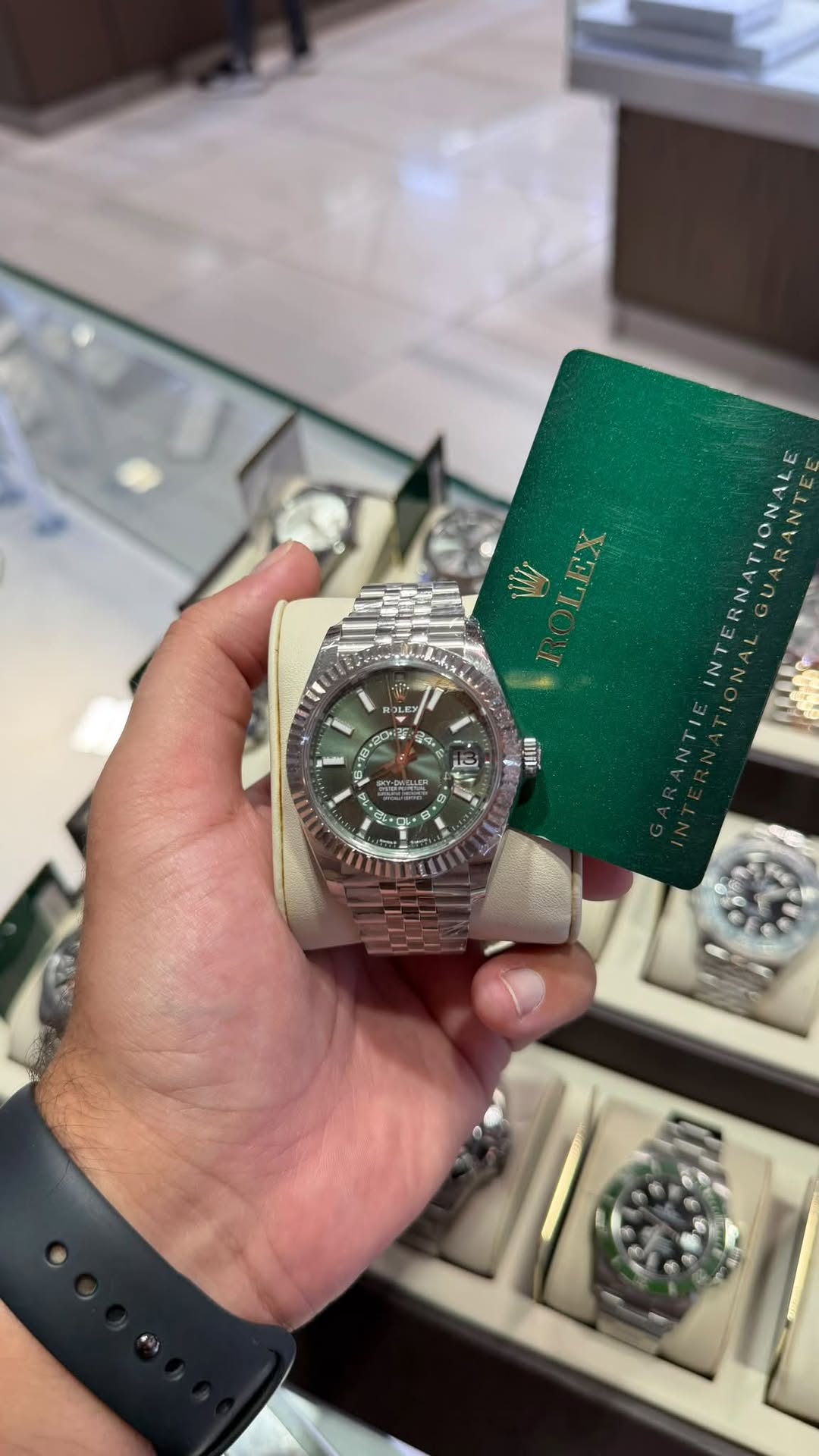 May be an image of wrist watch and text