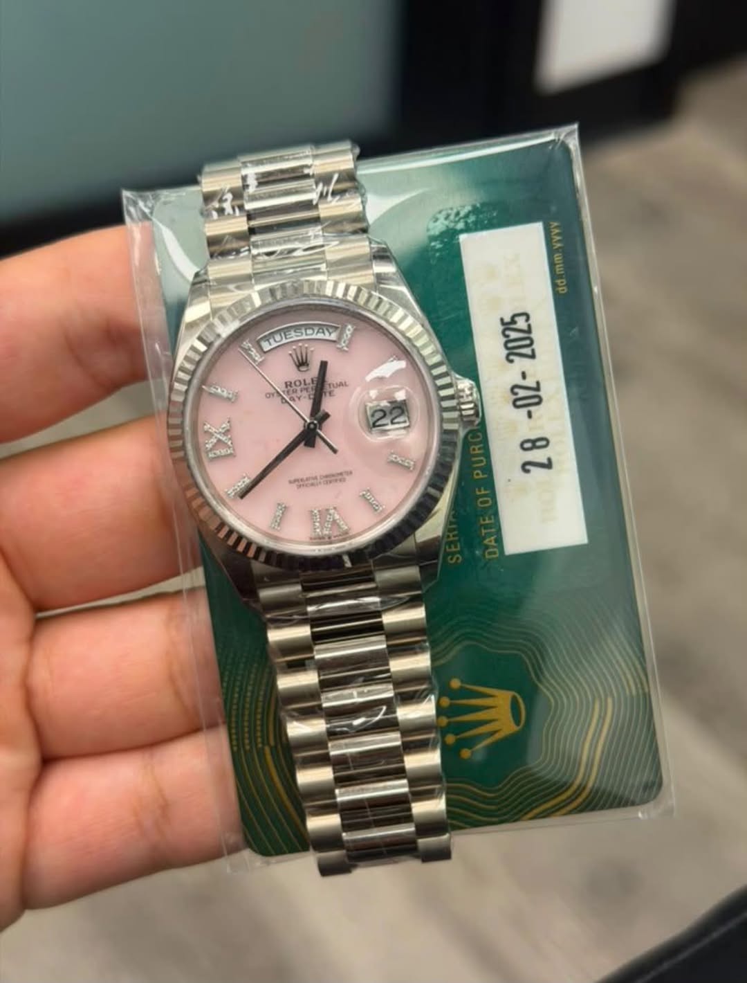 May be an image of wrist watch and text
