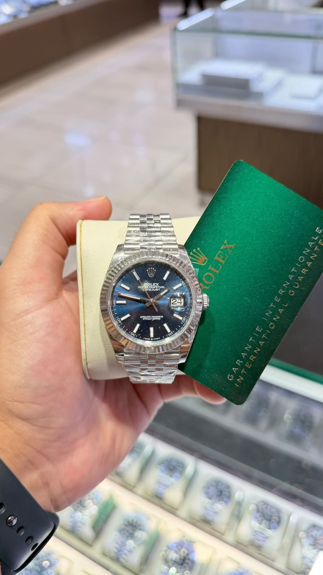 May be an image of wrist watch and text
