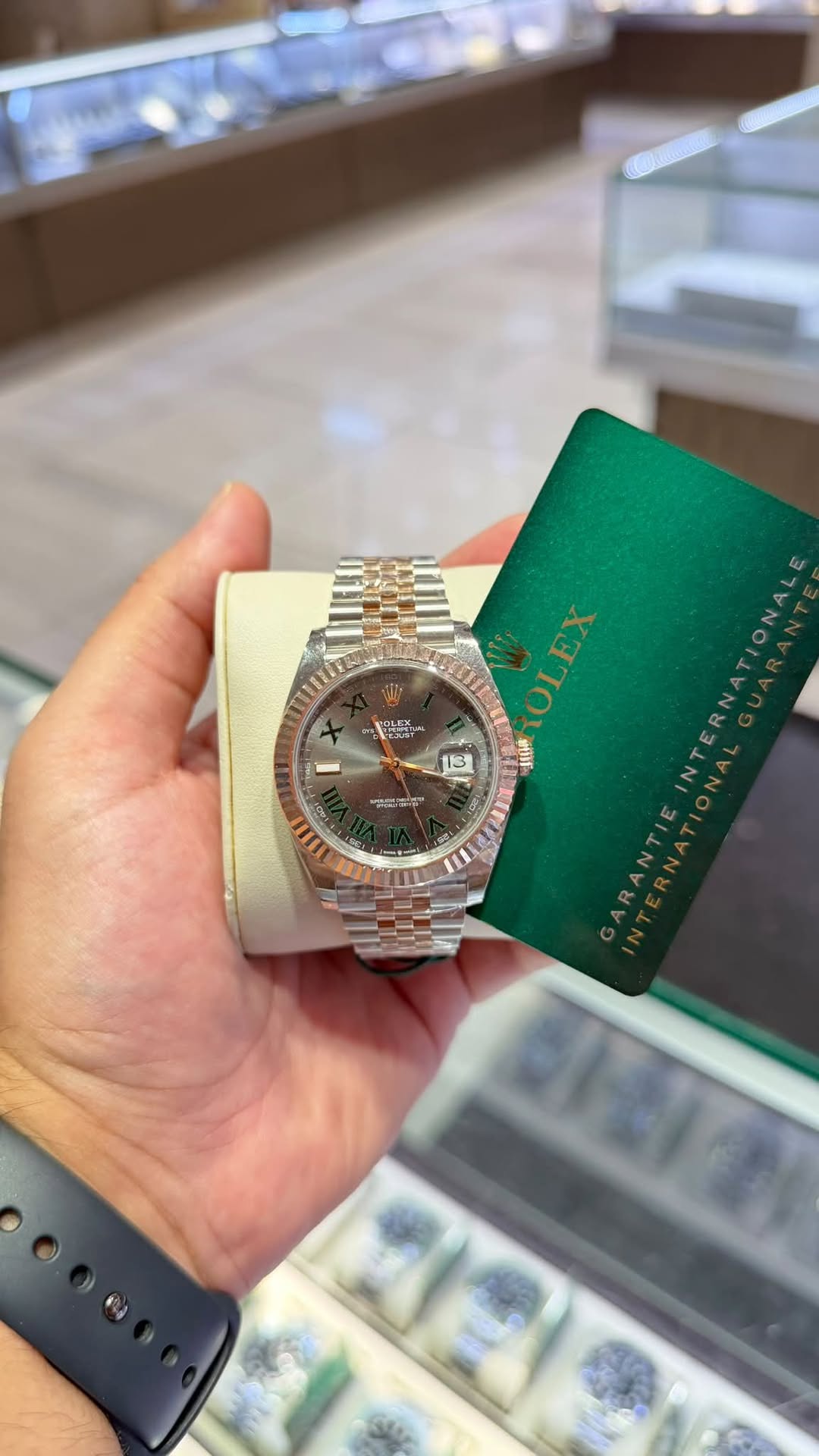 May be an image of wrist watch and text