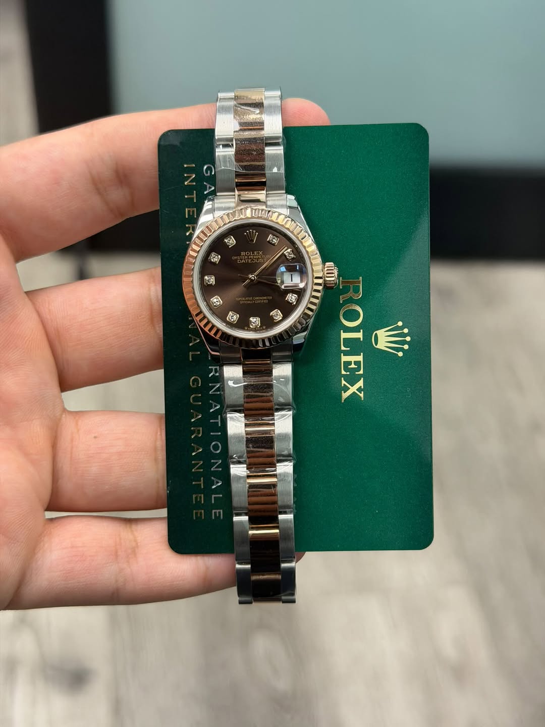 May be an image of wrist watch and text