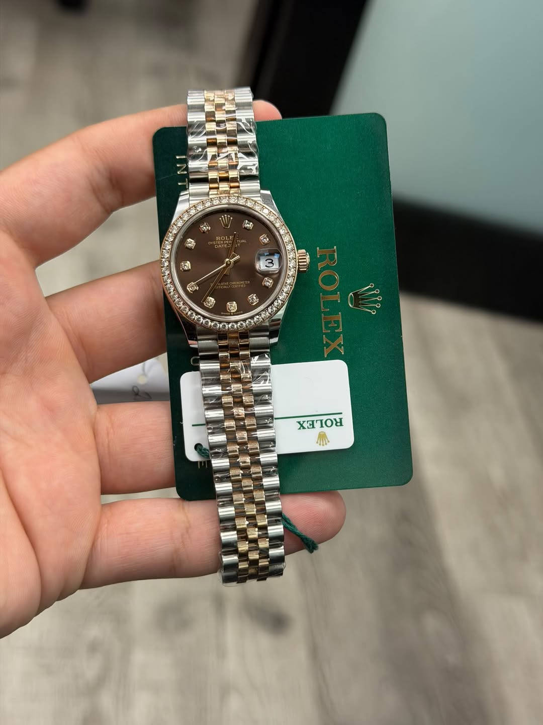 May be an image of wrist watch and text