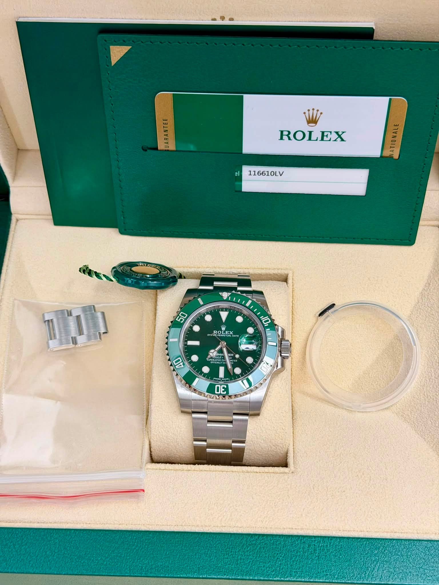 May be an image of wrist watch and text that says 'E 시 ROLEX 116610LV 50 ROLEX 10 αΙ 40 2 D5'