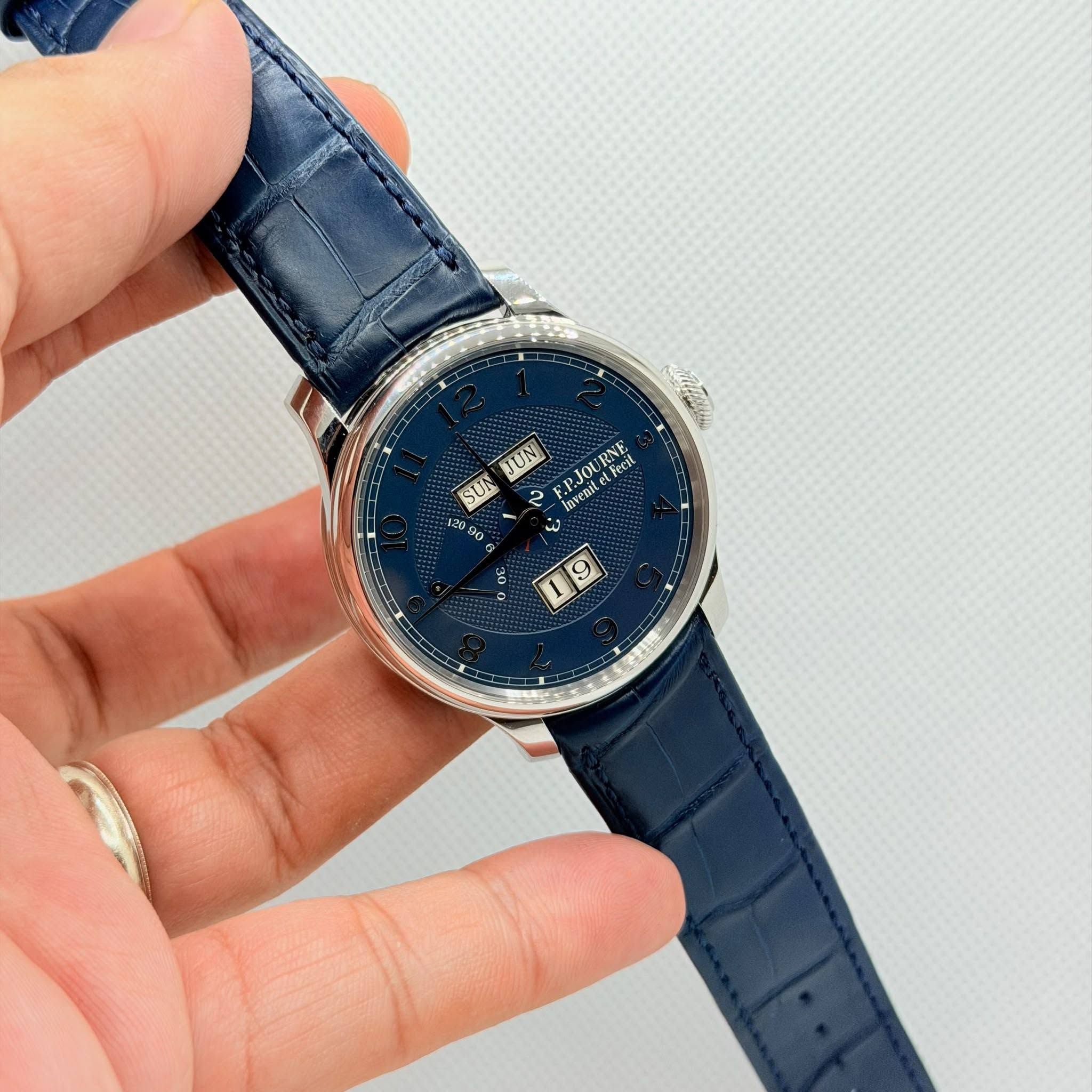 May be an image of wrist watch and text
