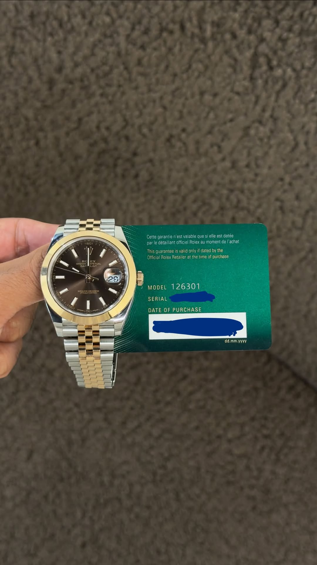 May be an image of wrist watch and text