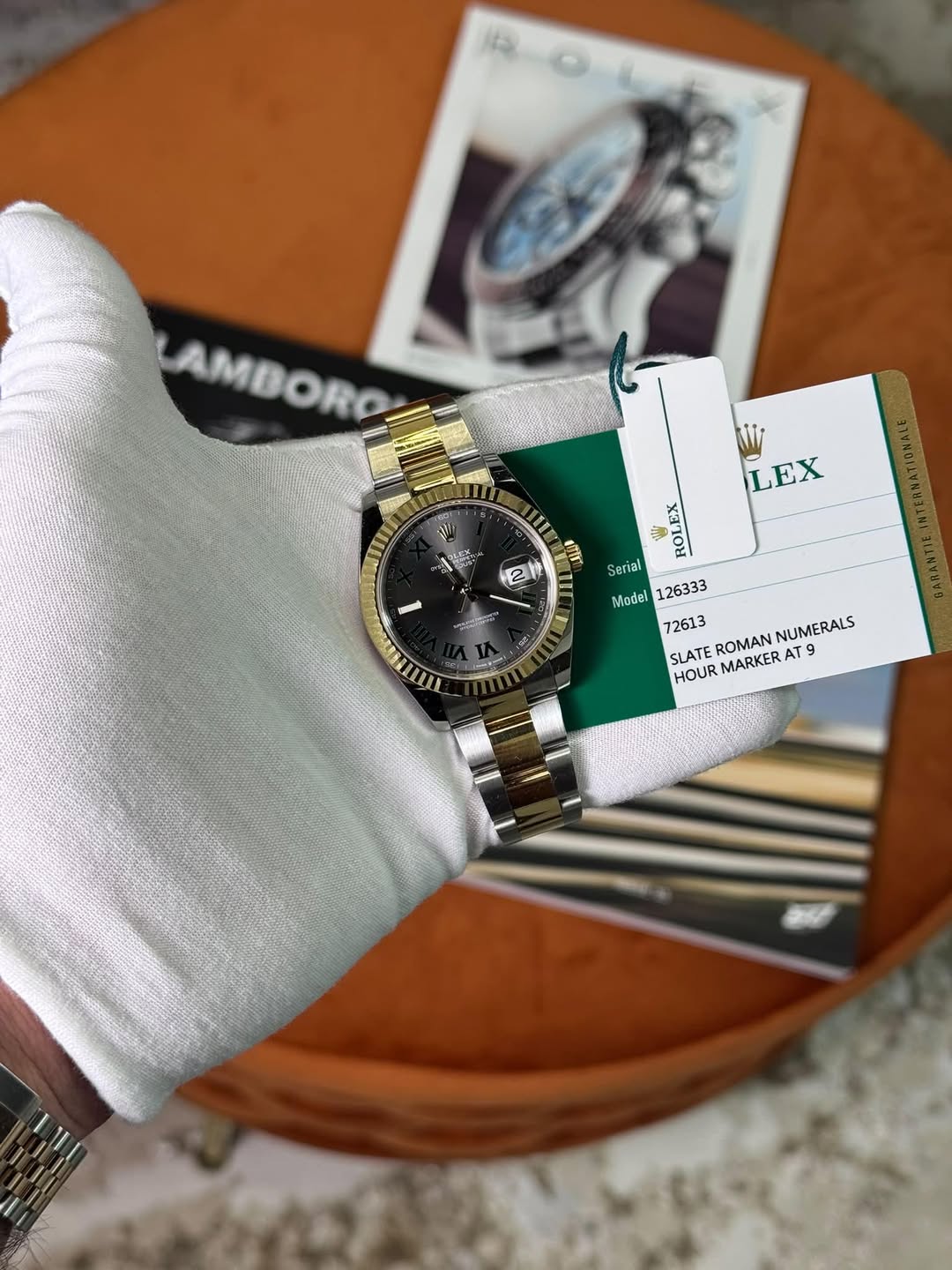 May be an image of wrist watch and text that says 'AMBORO يت C 区 LEX m 2 1 ㅋ Serial Tial Madel126333 Model SLATEROMAN SLATEROMANNUMERALS SLATE ROMAN AT T9 9 NUMERALS HOUR…
